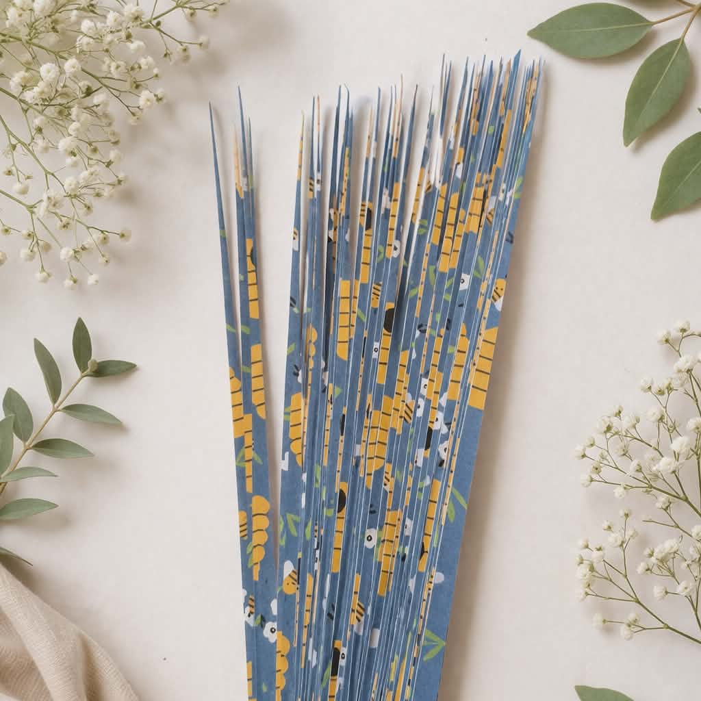 Decorative strips with blue and gold pattern on a light background with flowers and fabric.