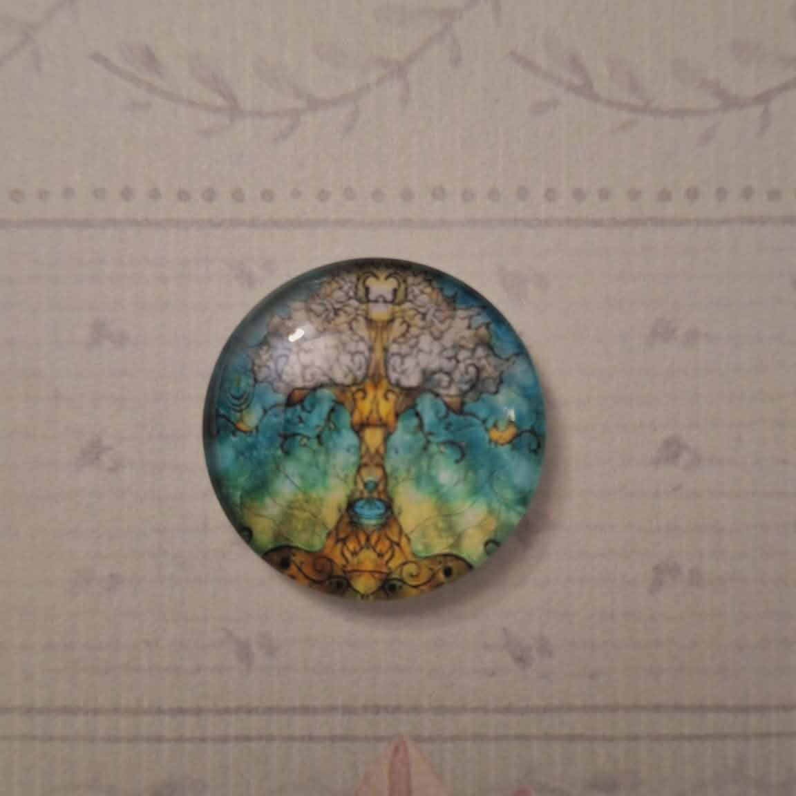 Decorative circular piece with floral design on a textured wall.