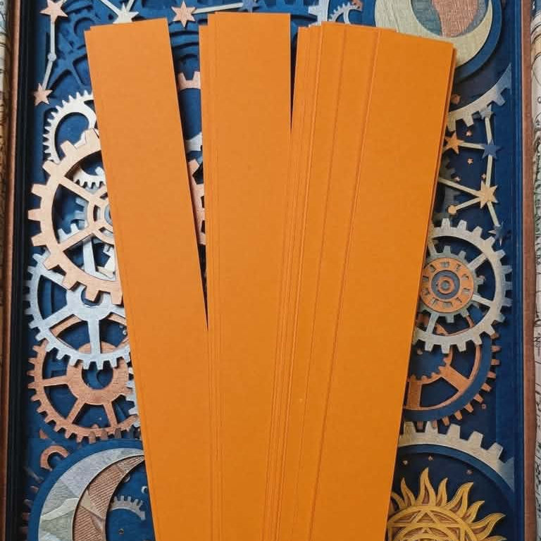 Gold and yellow 16 mm barrel-shaped paper bead strips on mystical background
