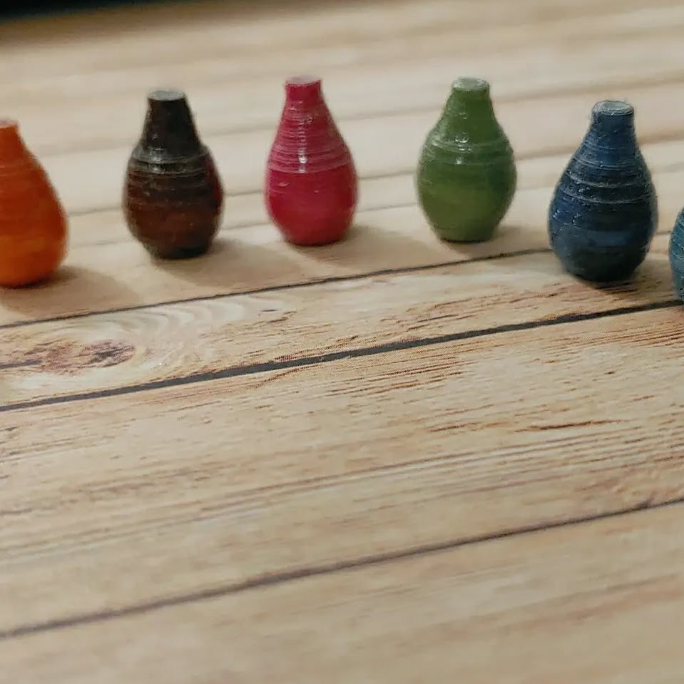 Colorful miniature bottles arranged on a wooden surface