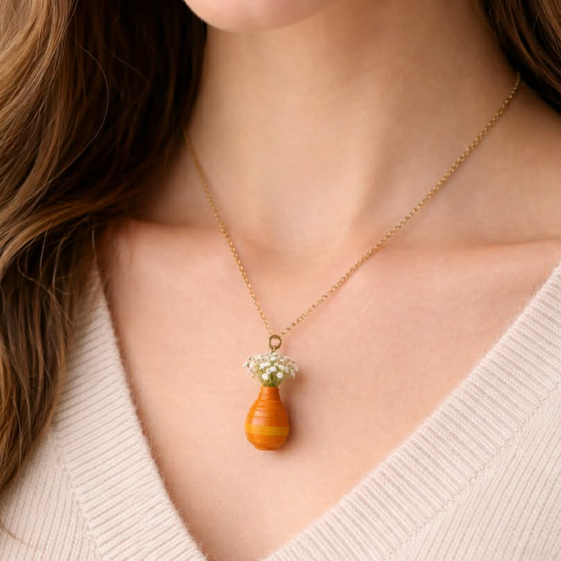 Necklace with a wooden pendant worn by a person