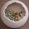 Olive Grove Devotion DIY Rosary Bead Kit with sage green pearl beads, speckled brown accents, and gold crucifix components
